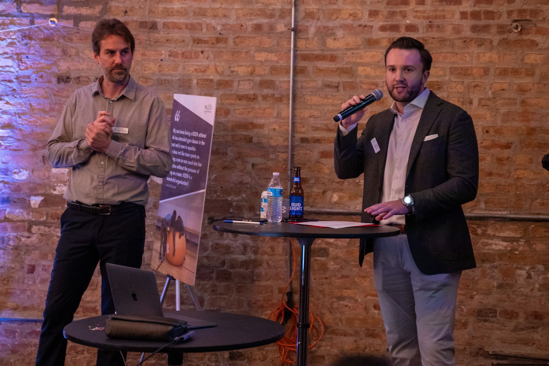 KEEN Chicago BOD President presents at the event. Standing to his right is KEEN Chicago Program Coordinator.