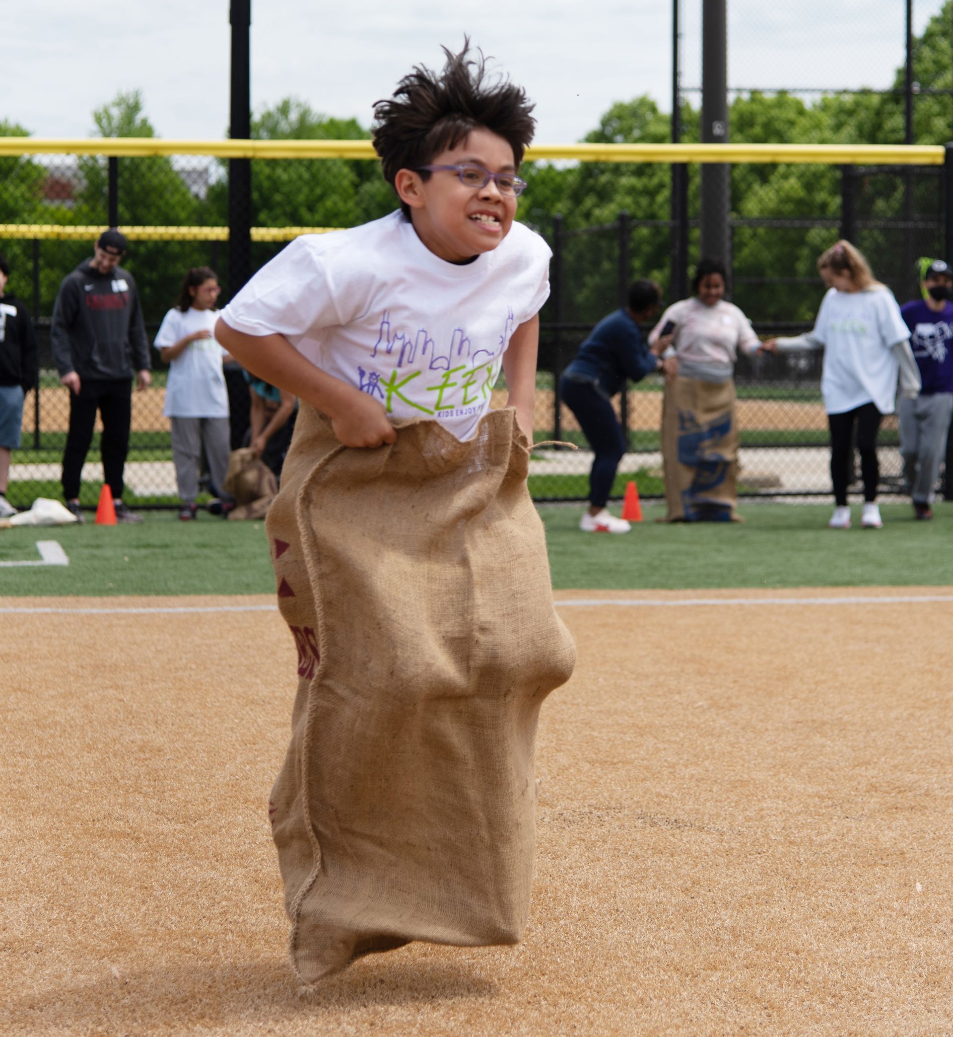 Boy hopping in gunie sack