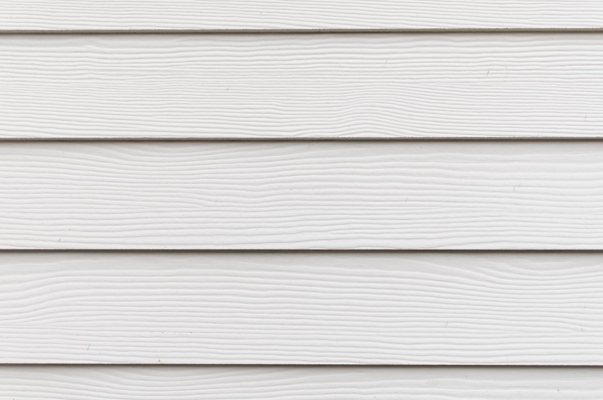 White horizontal wood siding panels with subtle gray grain lines