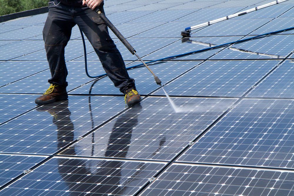 Cleaning Thoroughly the Solar Panels with High Pressure Washer  — Highlands Window Cleaning in Mittagong, NSW