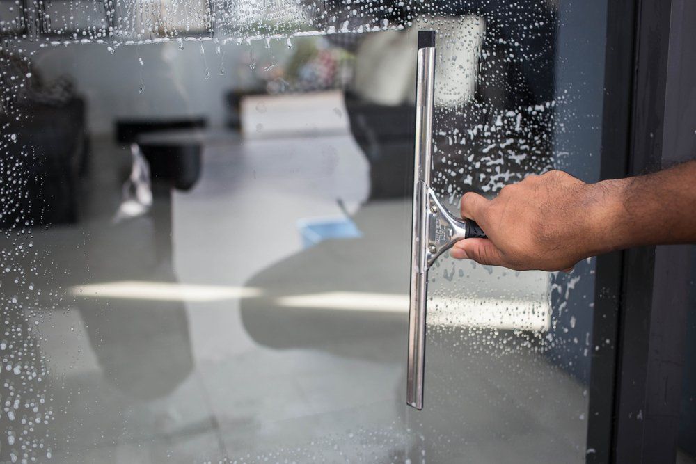 Removing Glass Cleaner on the Sliding Door — Highlands Window Cleaning in Mittagong, NSW