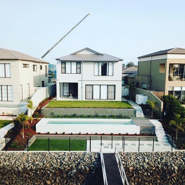 An aerial view of a house with a swimming pool