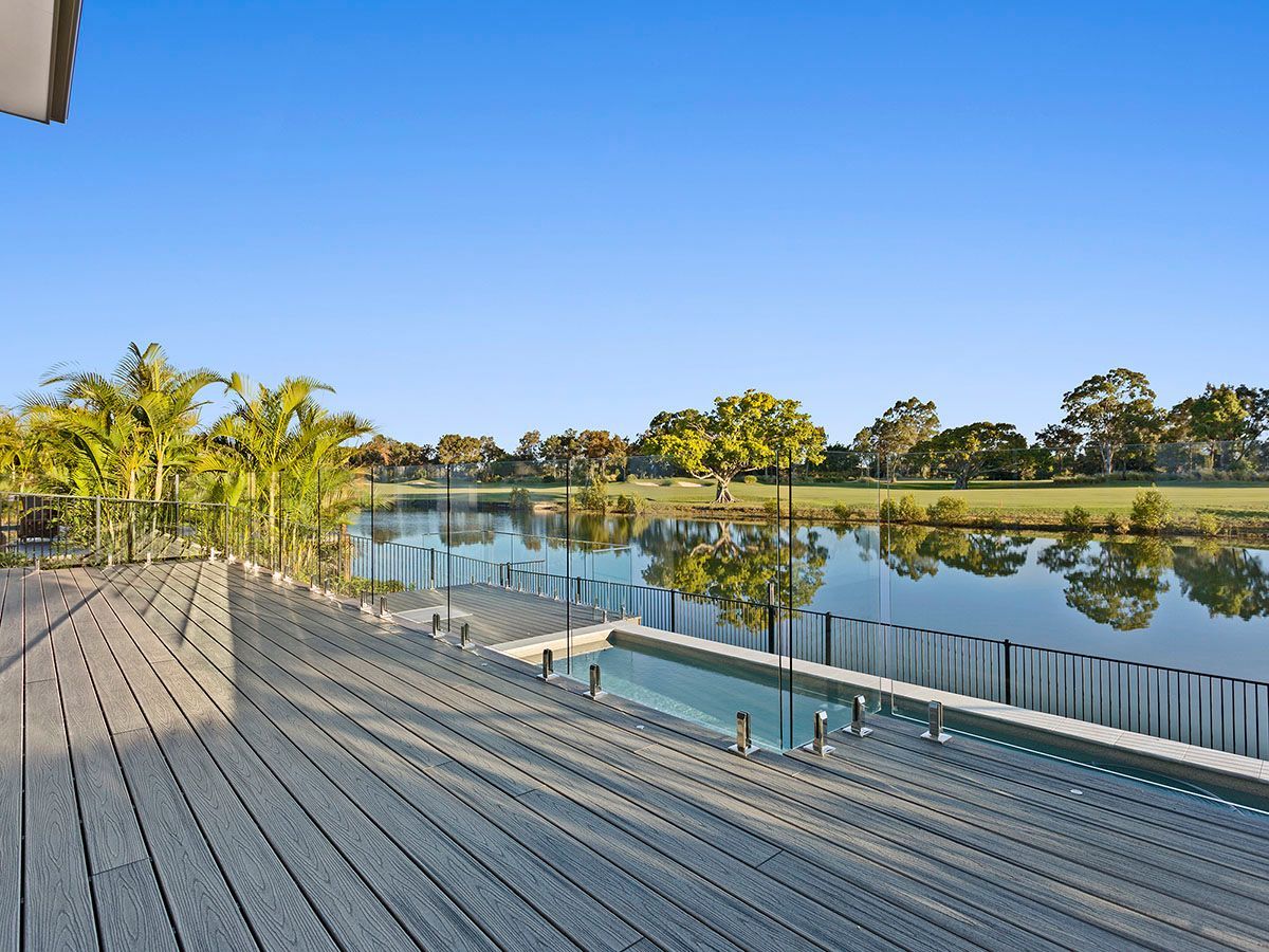 A wooden deck overlooking a large body of water.
