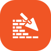 A trowel is being used to build a brick wall.