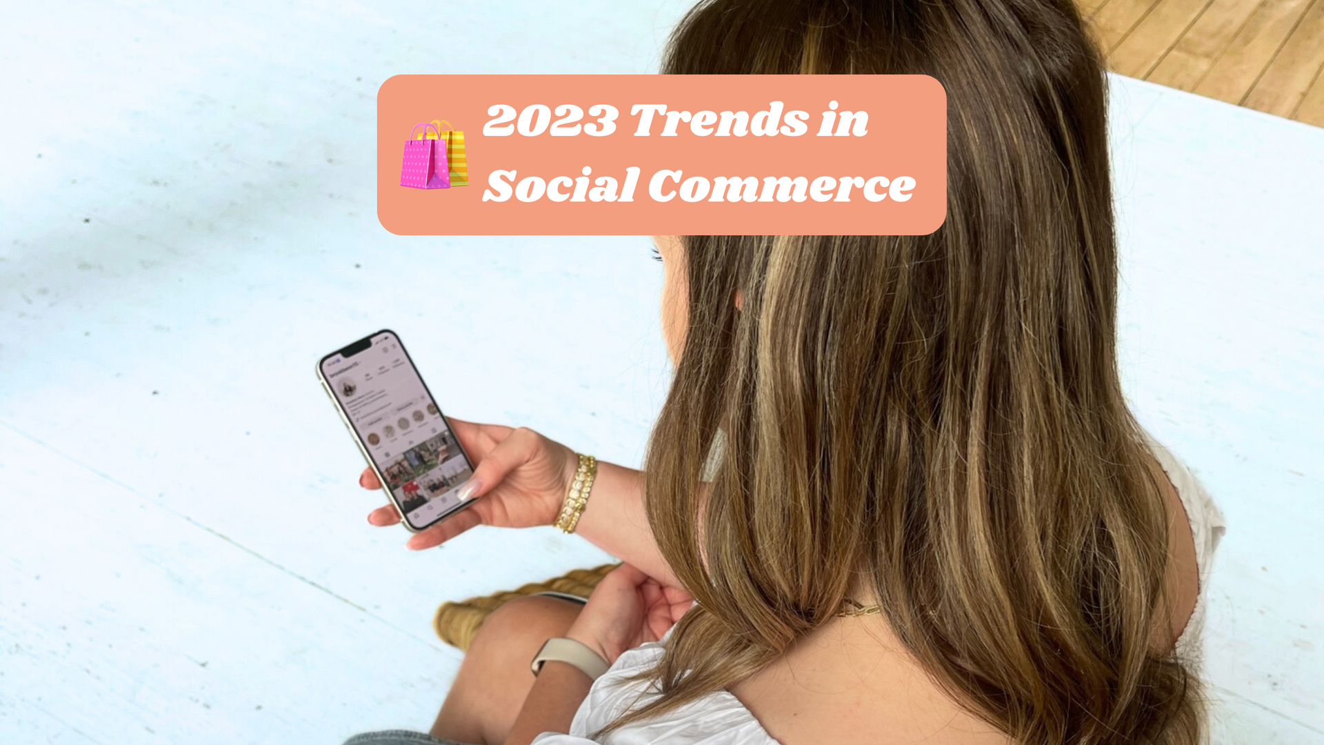 woman on phone looking at social media ecommerce