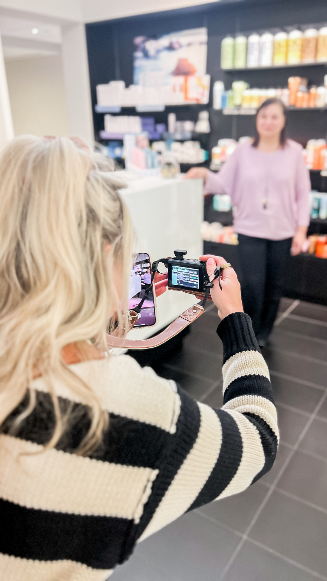 how to create original content woman taking picture of business owner