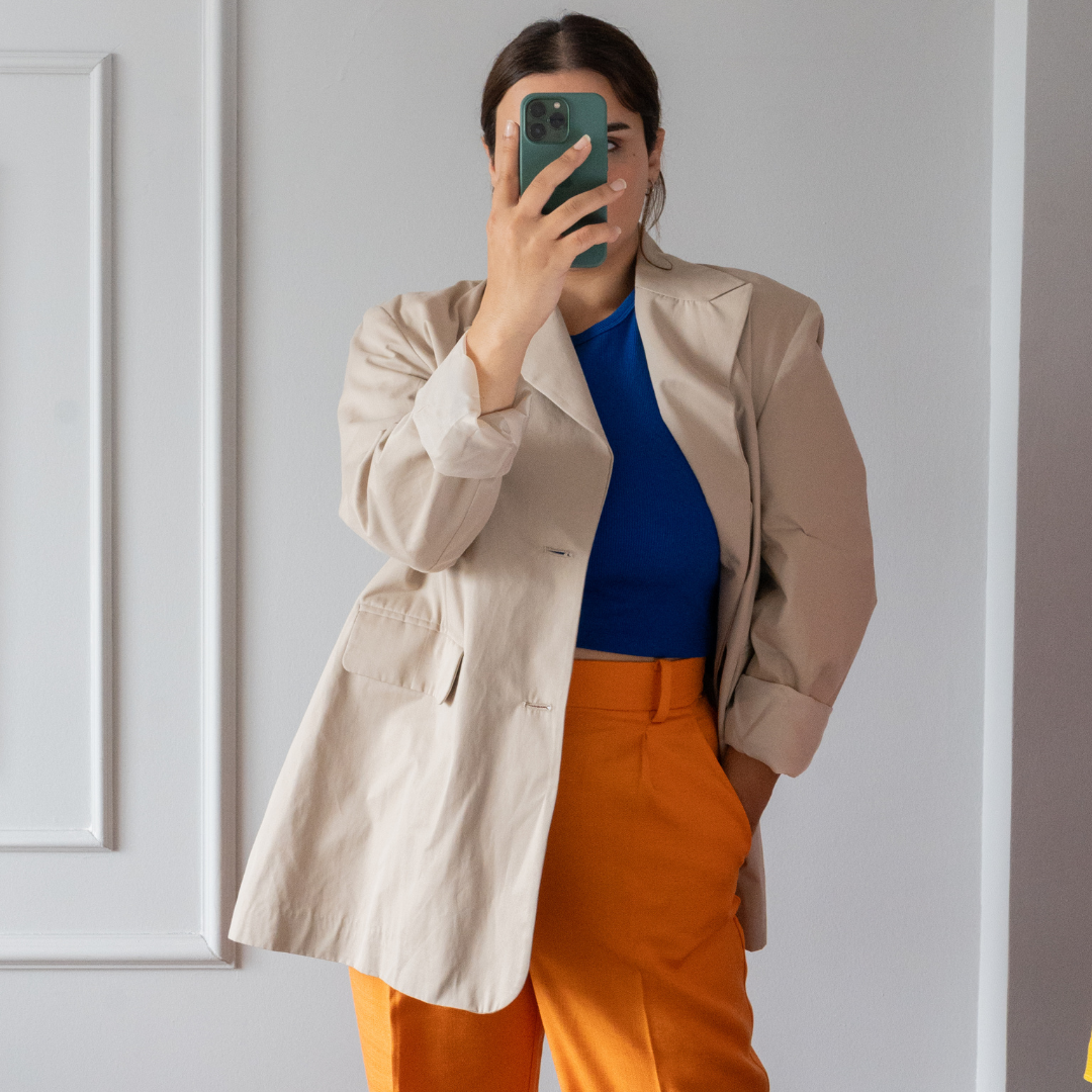 woman on cellphone doing ecommerce social media marketing