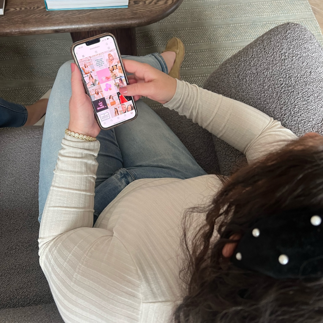 woman looking at an influencer marketing strategy on phone