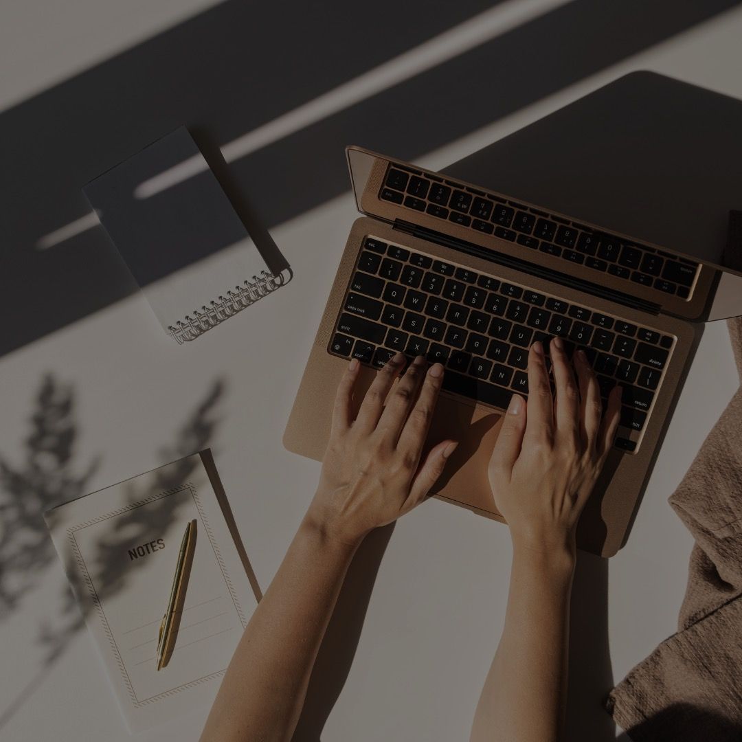 woman typing on computer