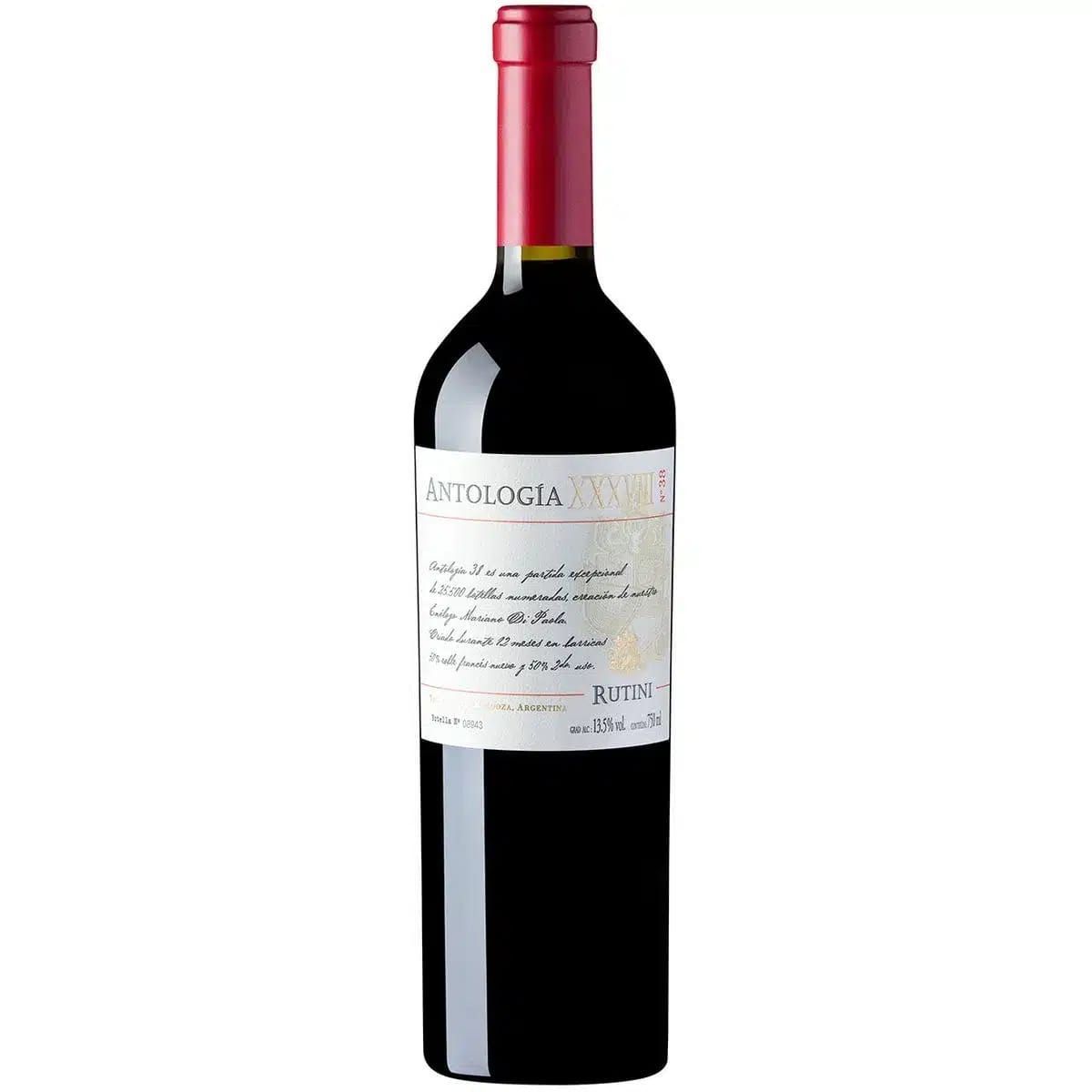 Botella de vino tinto con tapón rojo y etiqueta blanca.