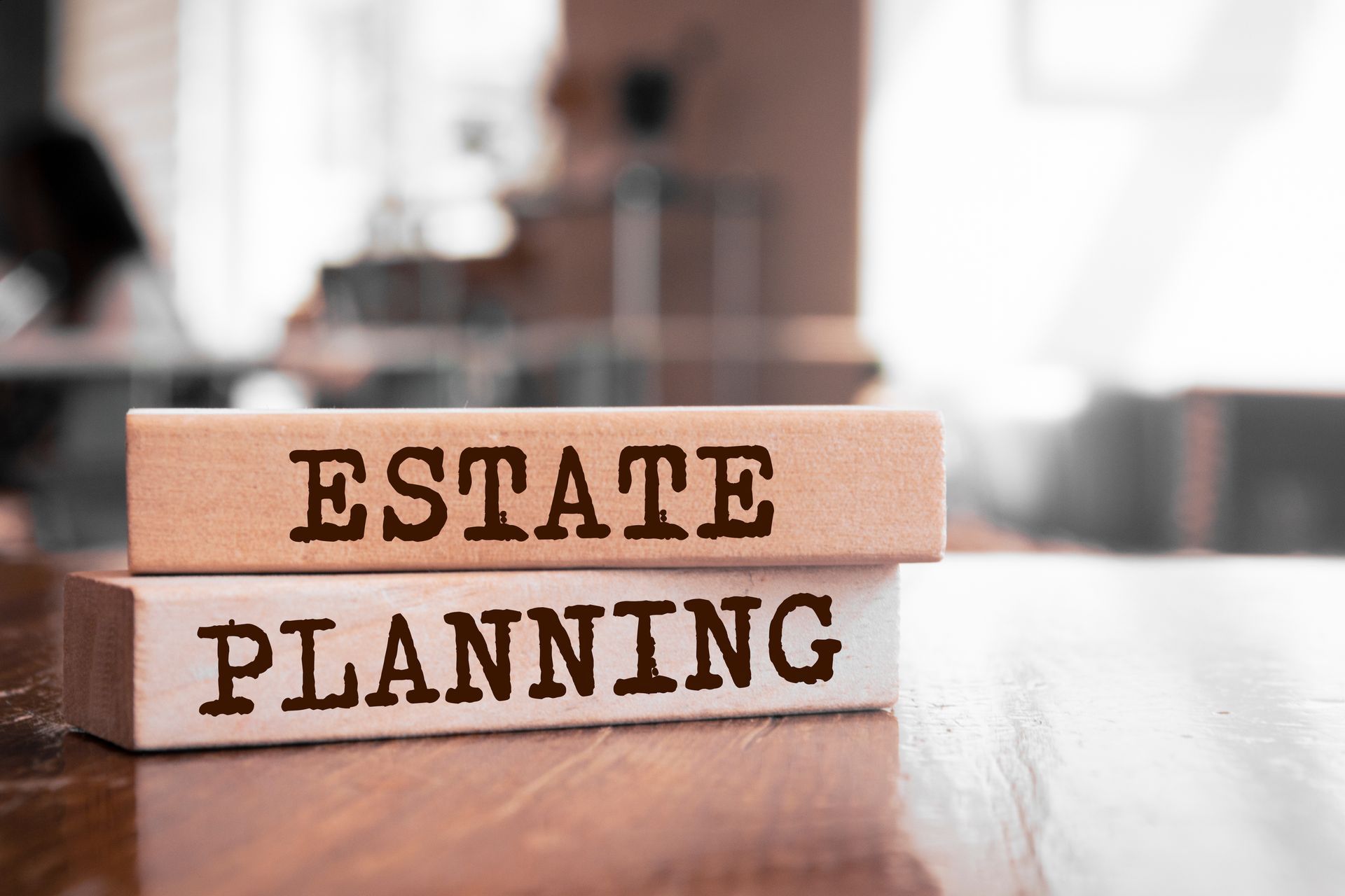Estate planning blocks on table, showcasing estate attorney services for organized legacy. Estate planning blocks on table, showcasing estate attorney services for organized legacy.