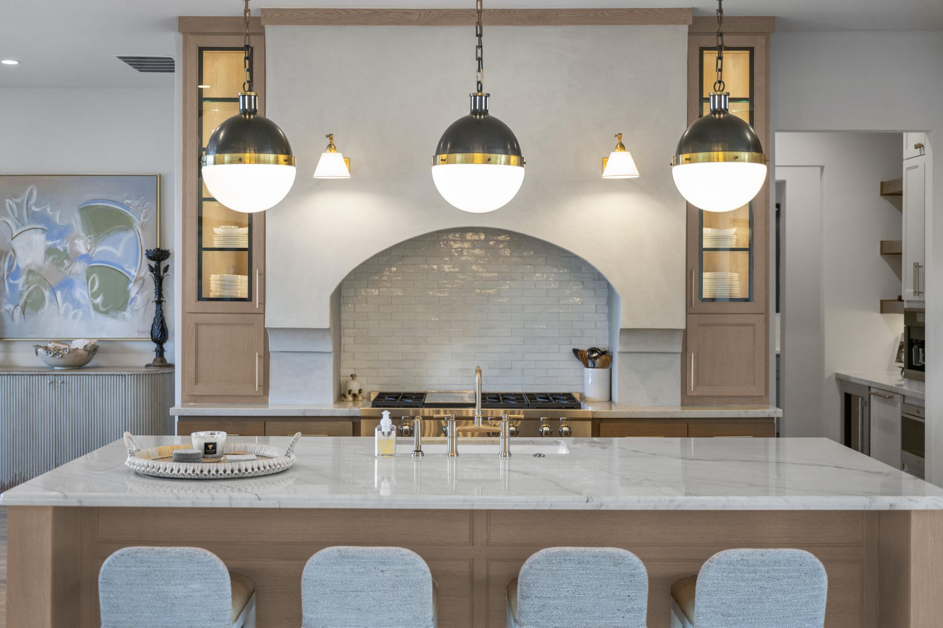 There is a large island in the middle of the kitchen.