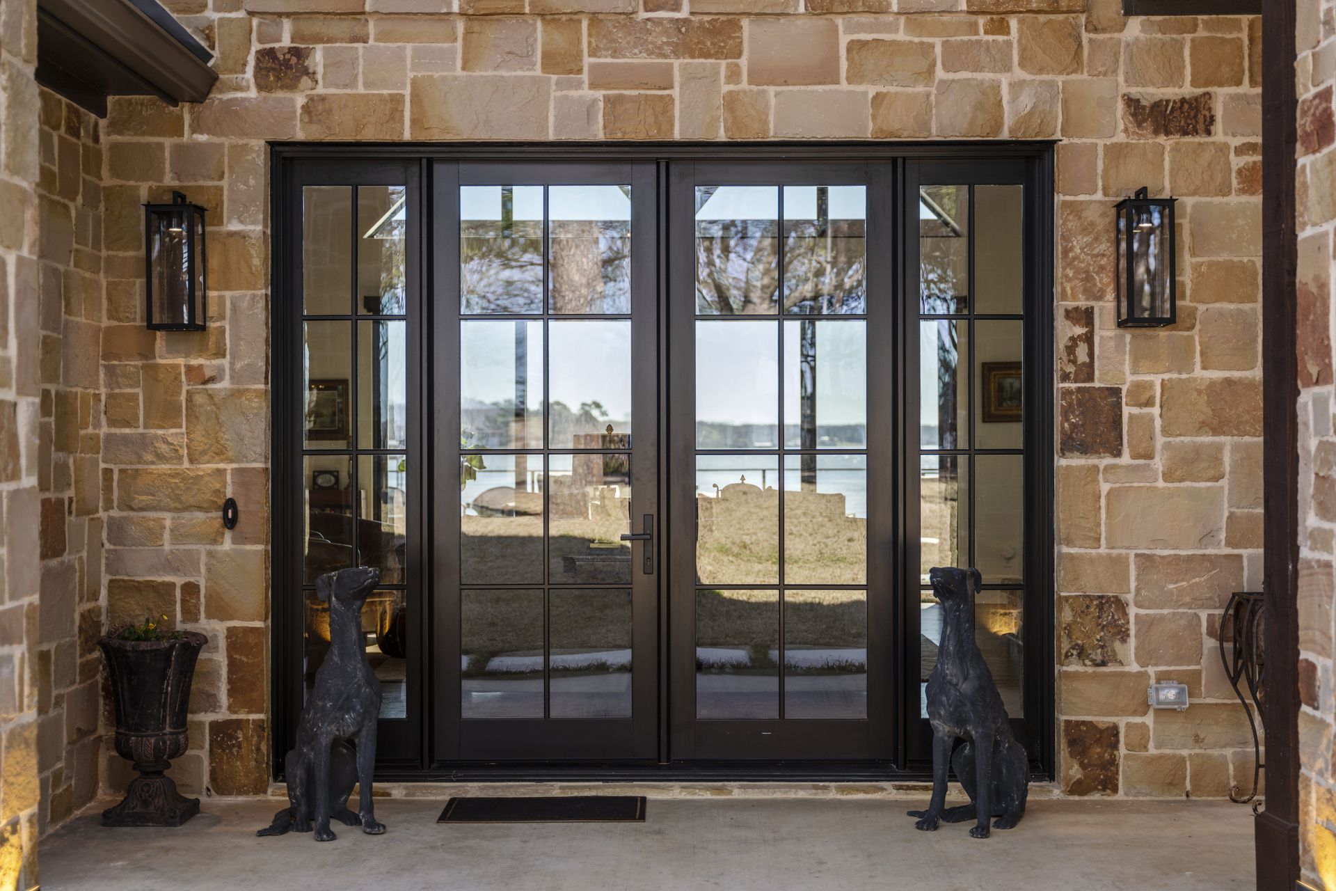 A statue of a dog sits in front of a door
