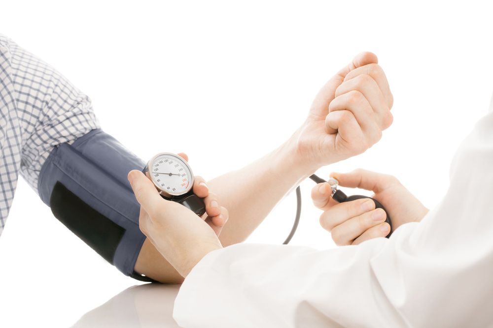 A Man's Arm is Getting His Vital Signs Read — Mount Archer Medical Centre in Berserker, QLD