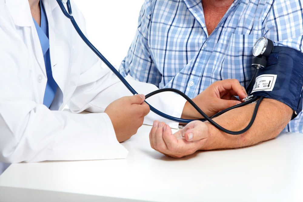 A Man is Getting His Blood Pressure — Mount Archer Medical Centre in Berserker, QLD
