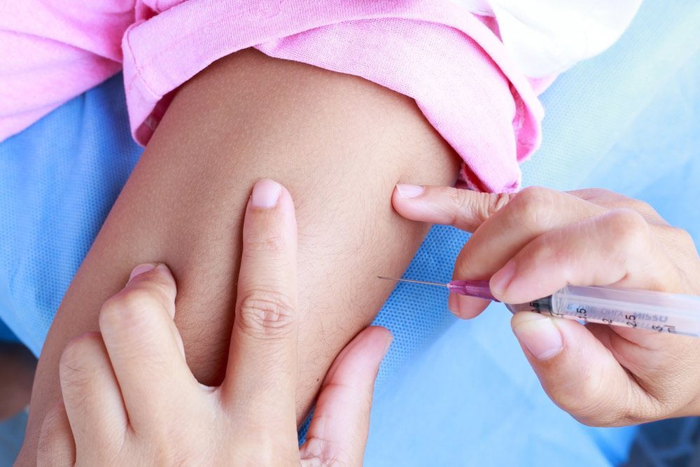 A Kid is Getting an Injection in Their Arm — Mount Archer Medical Centre in Berserker, QLD