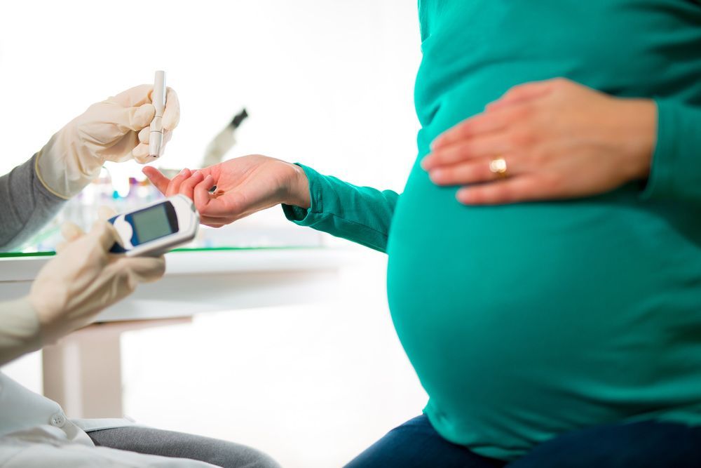 A Pregnant Woman is Being Tested for Diabetes by a Doctor — Mount Archer Medical Centre in Berserker, QLD