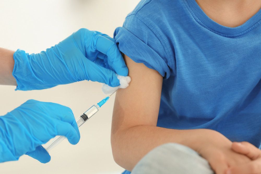 A Child is Getting an Injection in His Arm — Mount Archer Medical Centre in Berserker, QLD