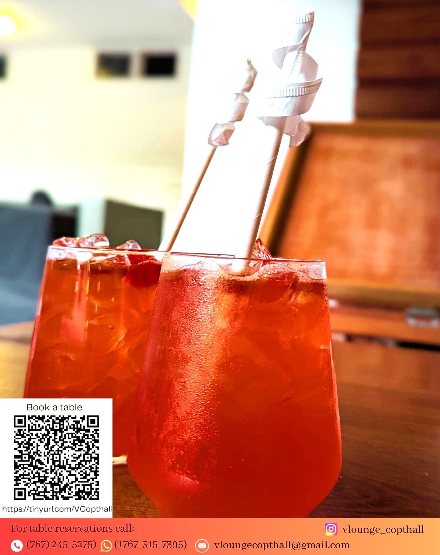 Two glasses of red drink with straws  at V lounge Restaurant inside Villa copthall. 