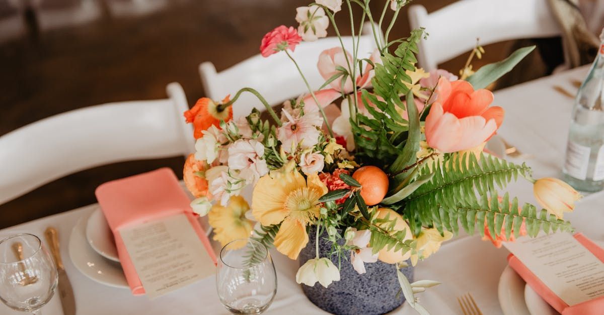 A table with a vase of flowers on it.