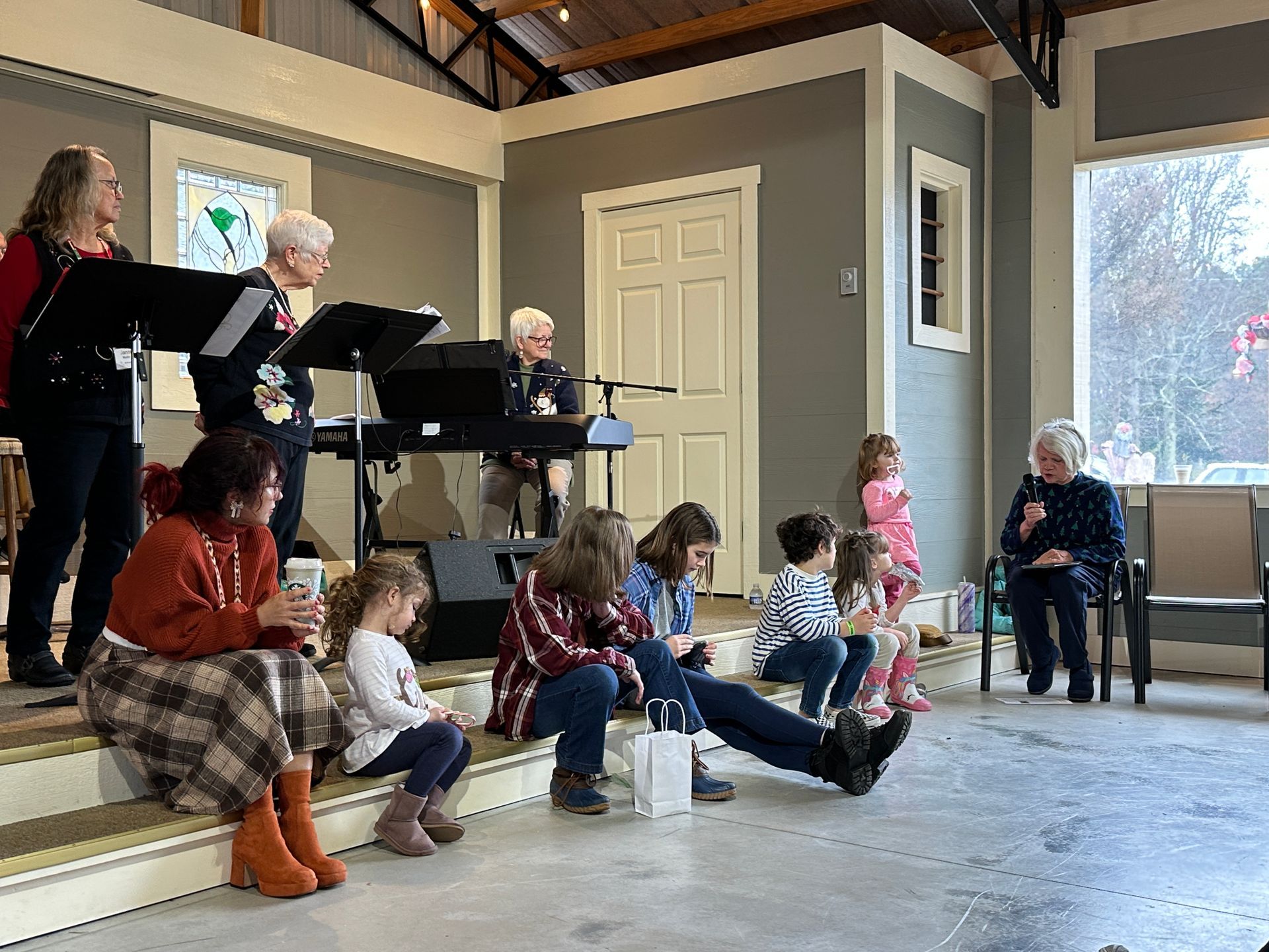 Kids gather together to listen to an Advent story