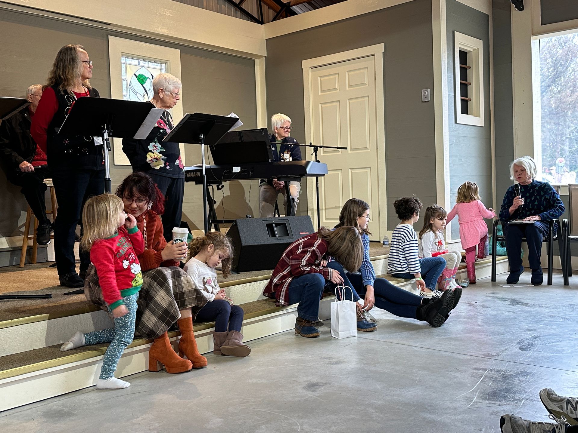 Kids gather together to listen to an Advent story