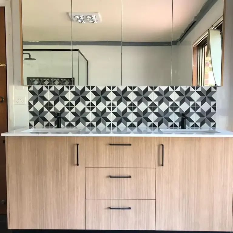 A Bathroom With Two Sinks And A Large Mirror — Infinity Kitchens & Cabinets in Yamba, NSW