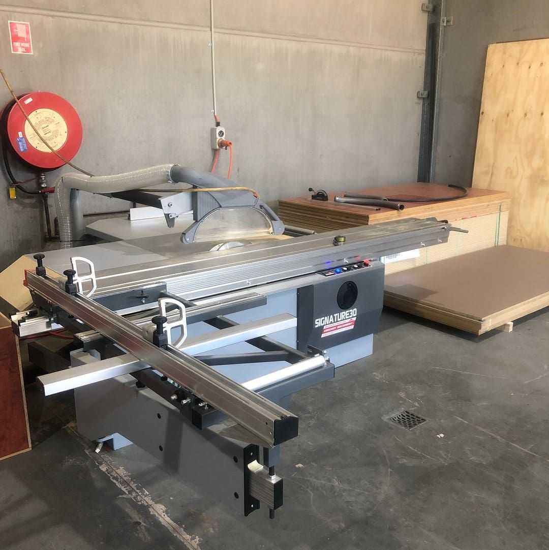 A Circular Saw Is Sitting In A Room Next To A Fire Hose — Infinity Kitchens & Cabinets in Kingscliff, NSW