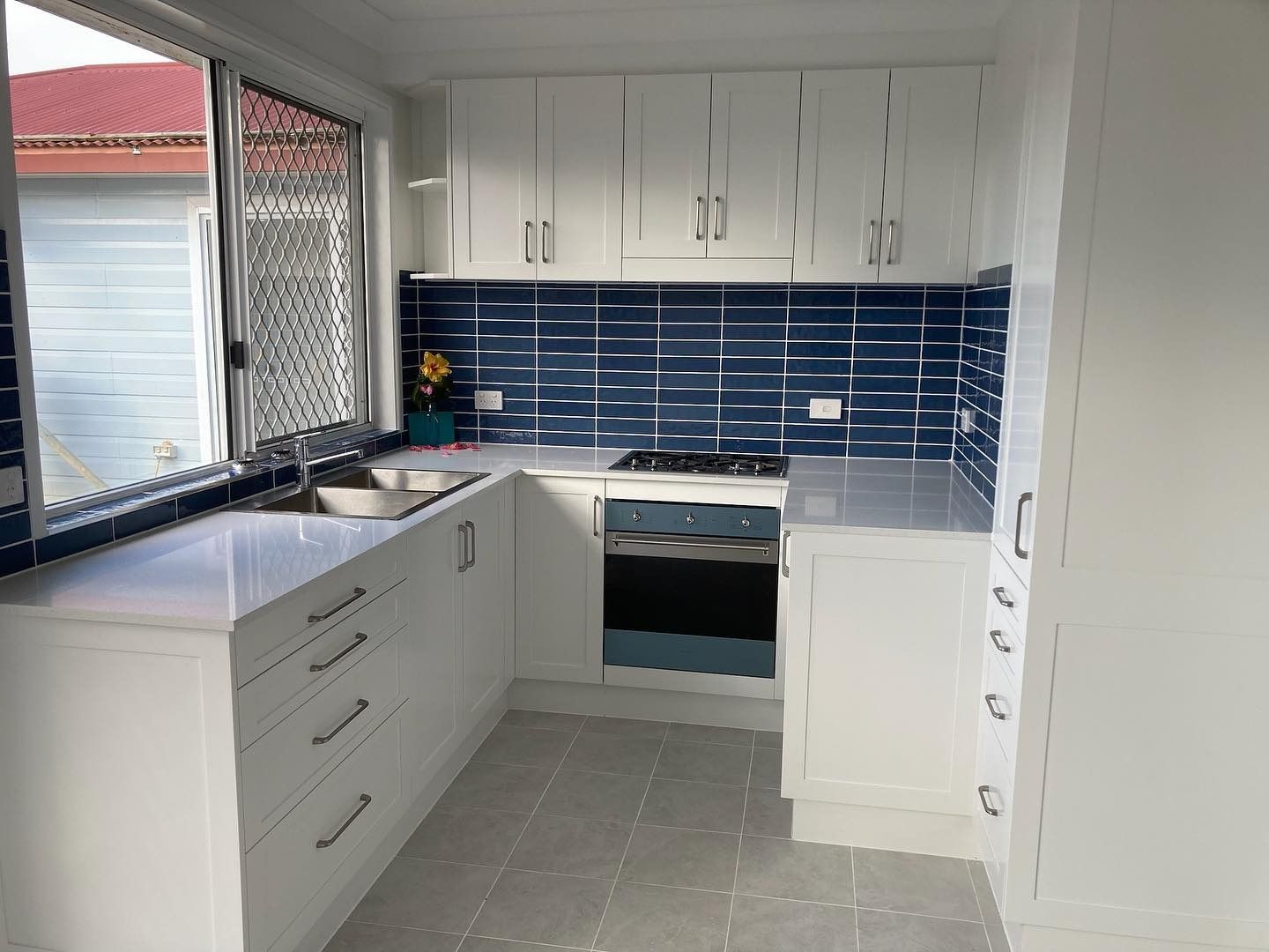 White Kitchen Renovation with Modern Cabinets