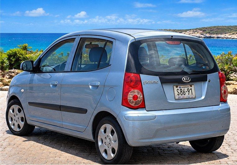 Lichtblauwe Kia Picanto huurauto op Curaçao, achteraanzicht