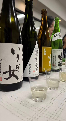 Guests enjoying a guided Japanese sake tasting experience at IN Sake Museum