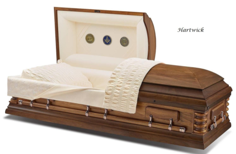 Open wooden casket with cream interior and white quilted lining on a white background