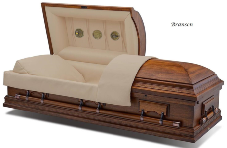 Beige-lined wooden casket with open lid, shown in profile