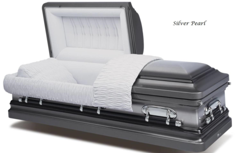 Silver casket with open lid and white satin lining, shown with a silver floral arrangement inside.