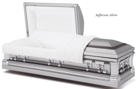 Silver open casket with white interior and floral accents on the side