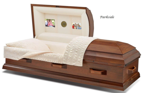 casket with white bedding and wood finish, shown in a studio product shot