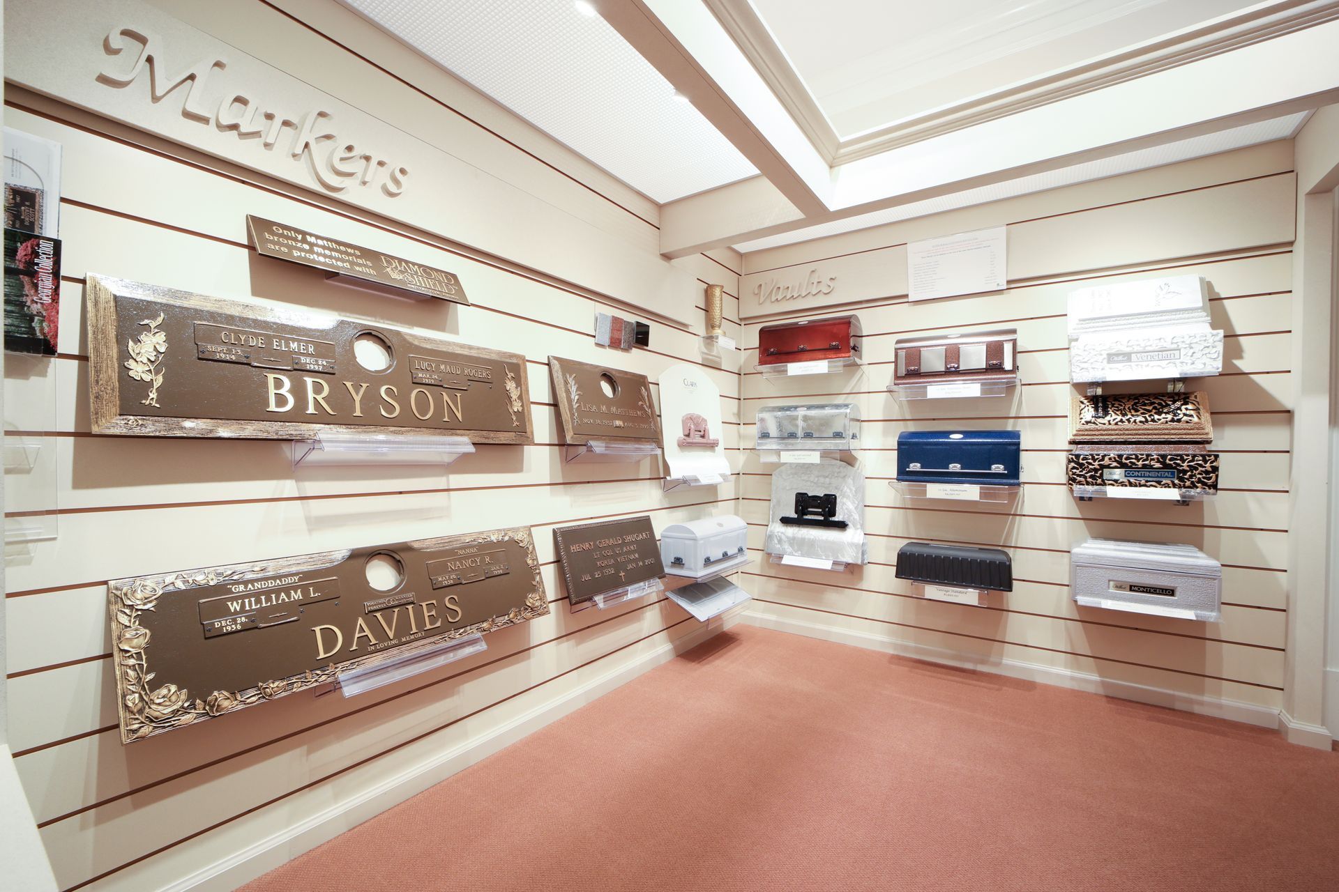Showroom display of decorative wall panels and fabric samples in a bright interior.