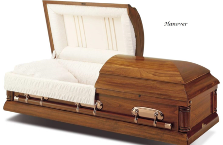 Wooden casket with cushioned white interior and upholstered lid, shown open on a white background