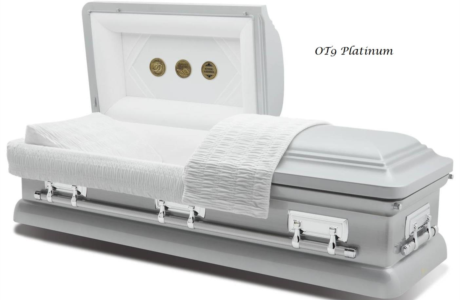 White funeral casket with silver hardware, lid open to reveal a white interior.