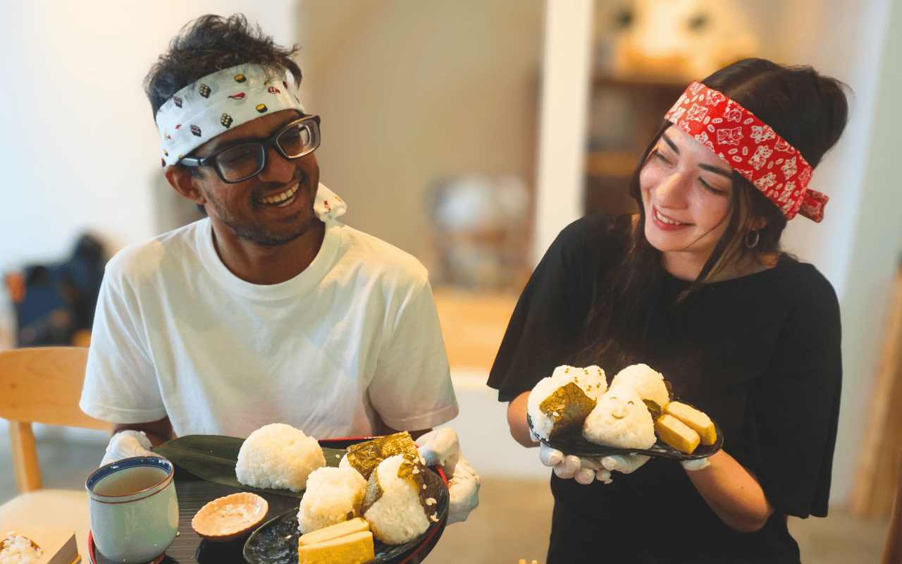 A couple making onigiri together