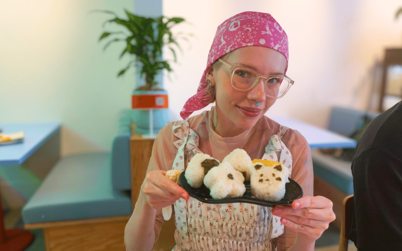 A solo guest making onigiri