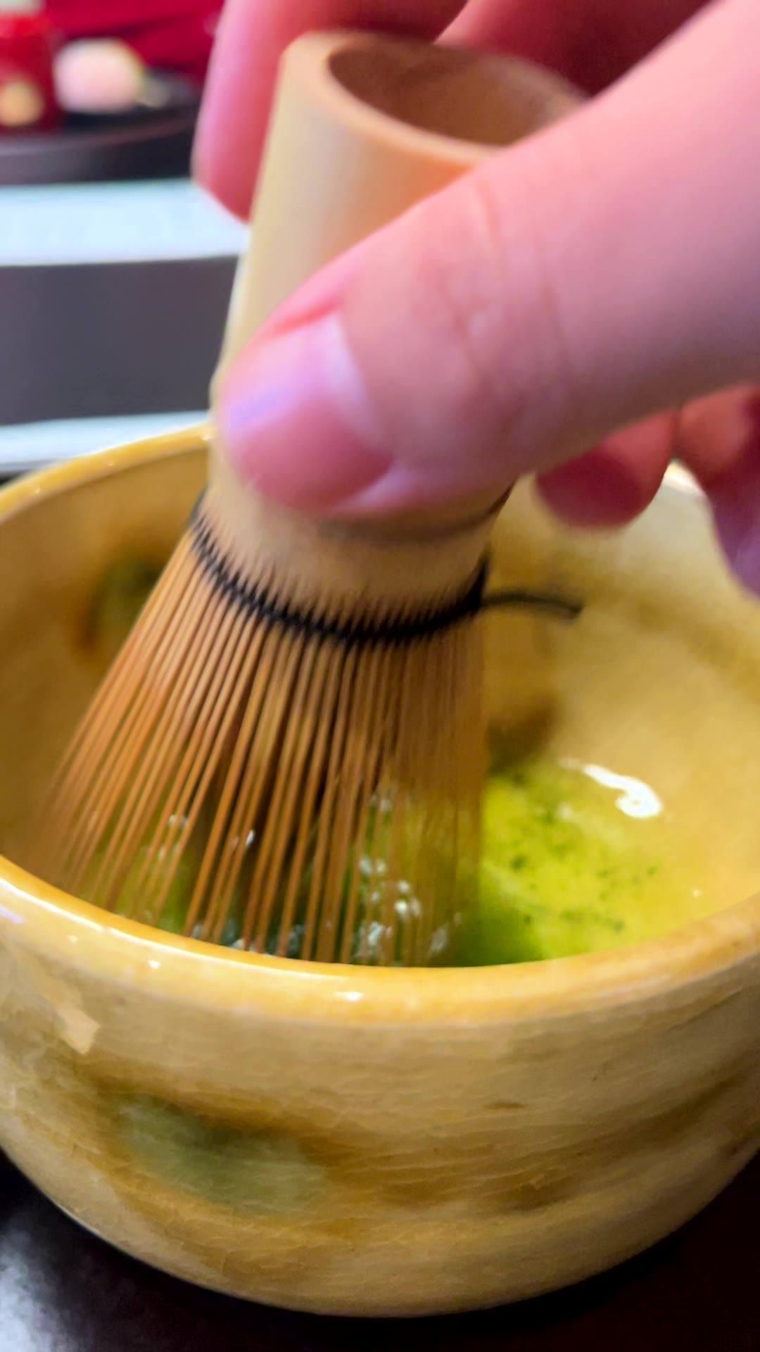 Whisking matcha in a bowl