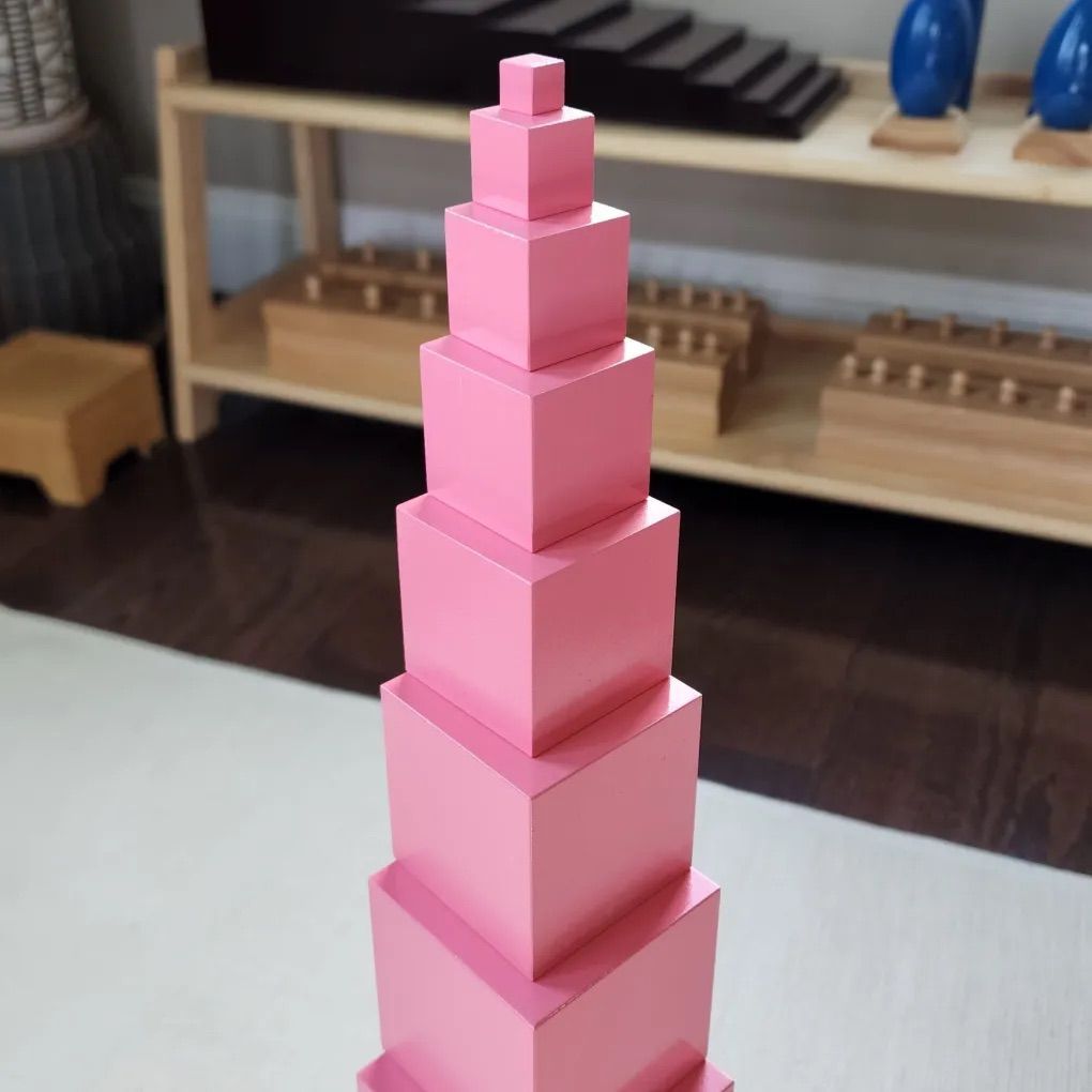 A stack of pink blocks are stacked on top of each other