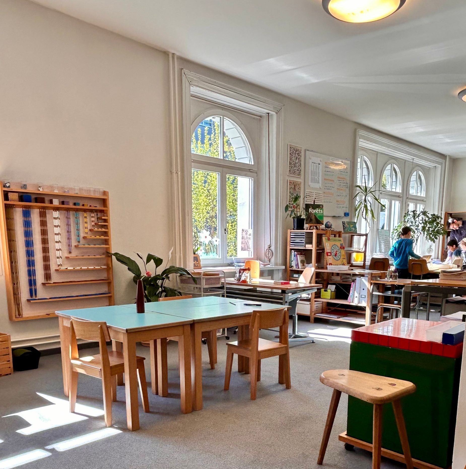 A large room with tables and chairs in it