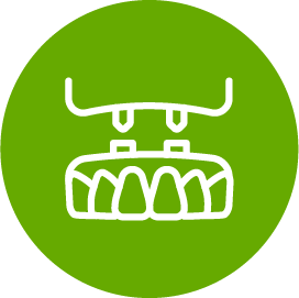 A green circle with a white icon of a denture in it.