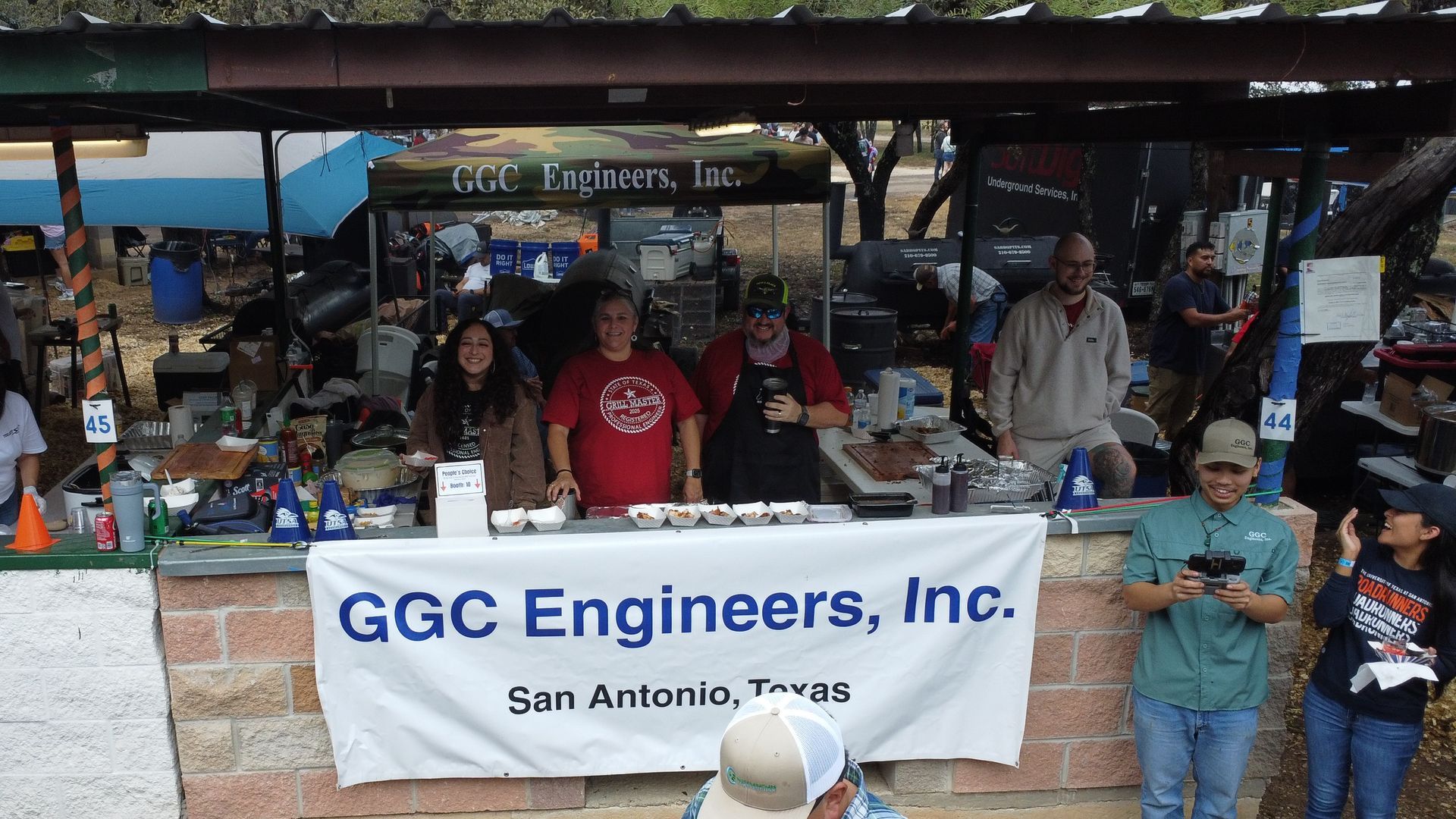 GGC Engineers, Inc. booth at a community event with people standing behind a banner in San Antonio, Texas