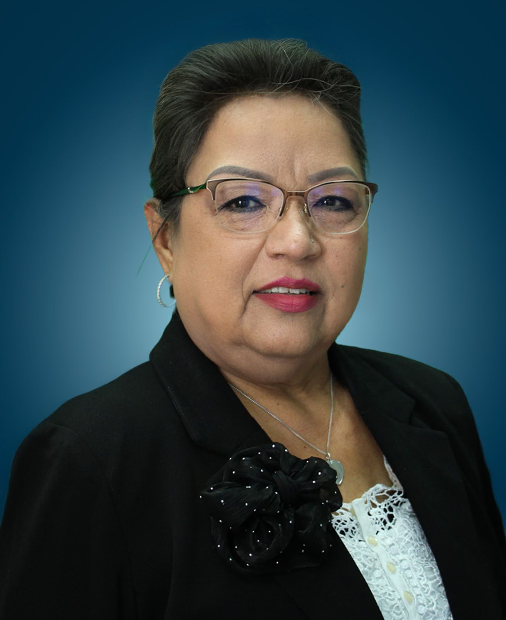Headshot of Yolanda Ybarra against a blue gradient background.