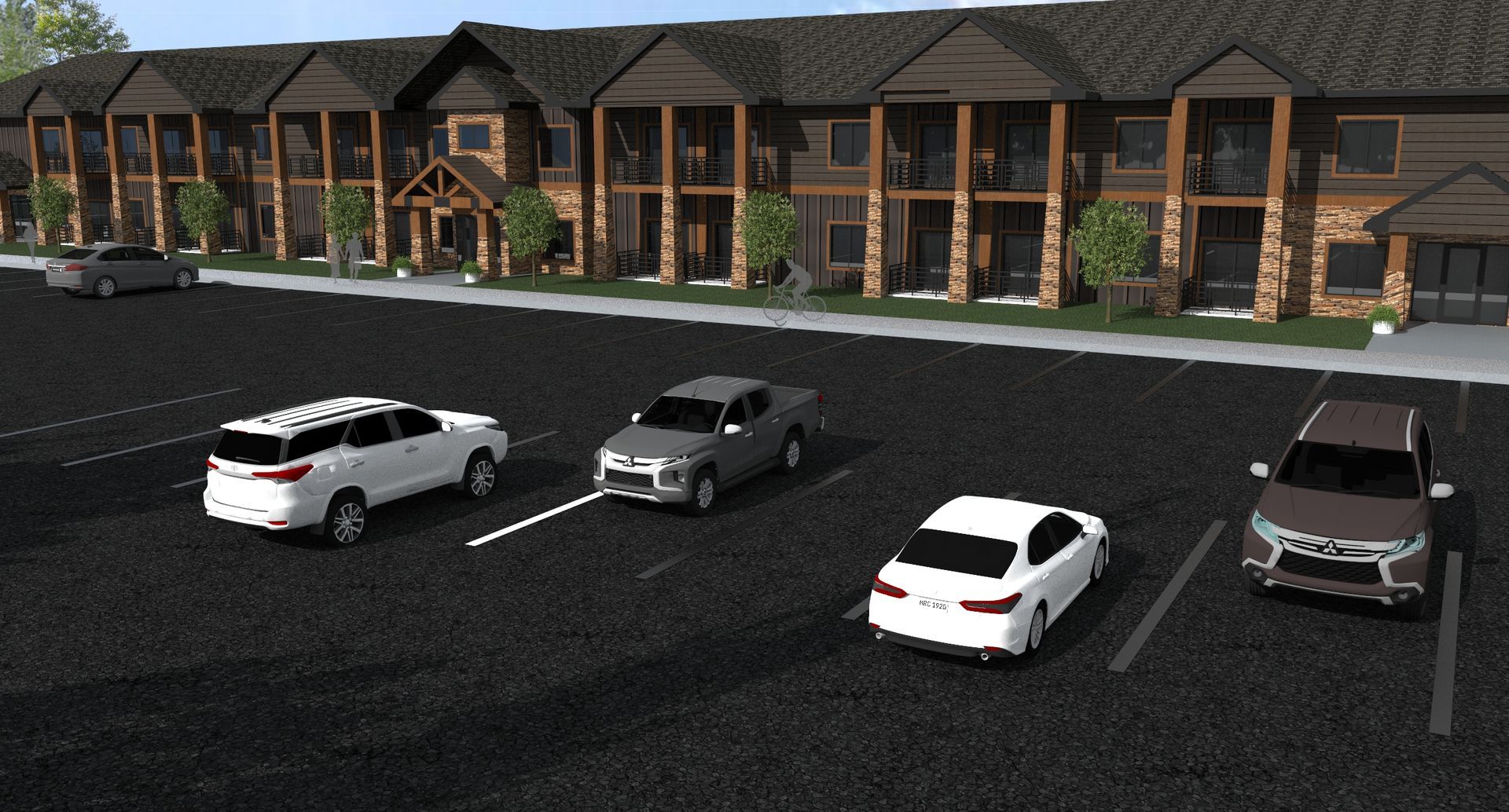 Cars are parked in a parking lot in front of a building