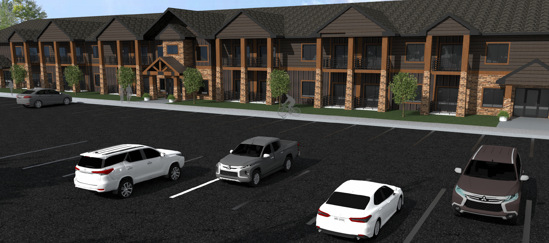 A parking lot with cars parked in front of a building