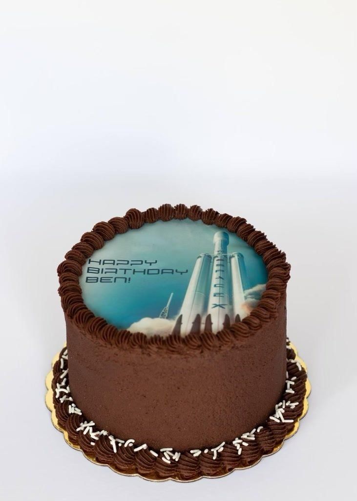 Chocolate cake with rocket ship image and